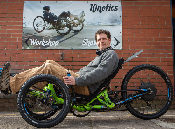 Queens Cross Workspace tenant Ben Cooper demonstrates one of his specialised bikes.