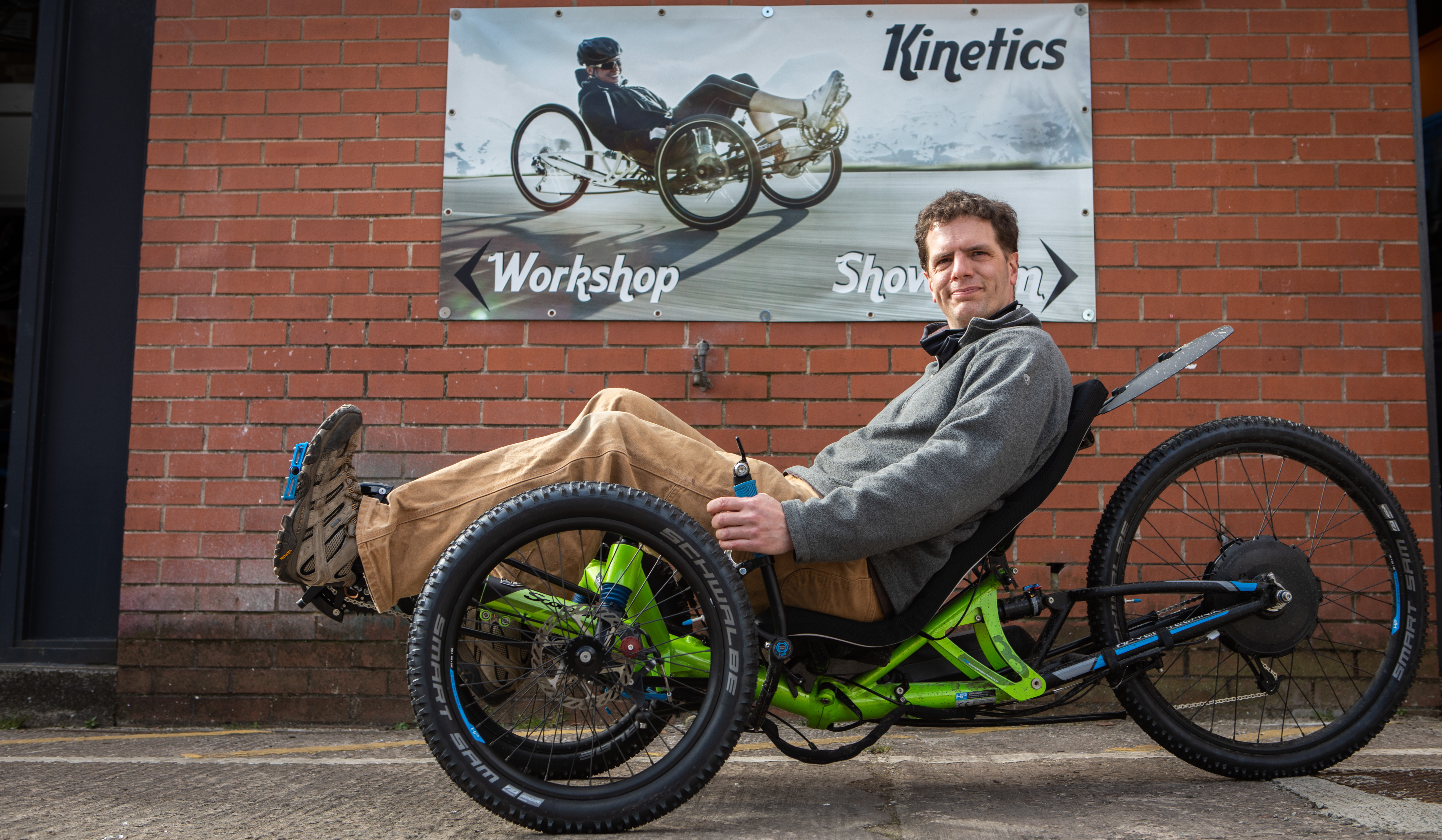 Queens Cross Workspace tenant Ben Cooper demonstrates one of his specialised bikes.